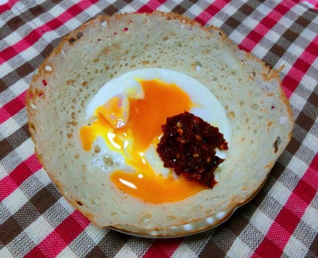 Sri Lankan egg hopper breakfast bowl shaped pancake with egg